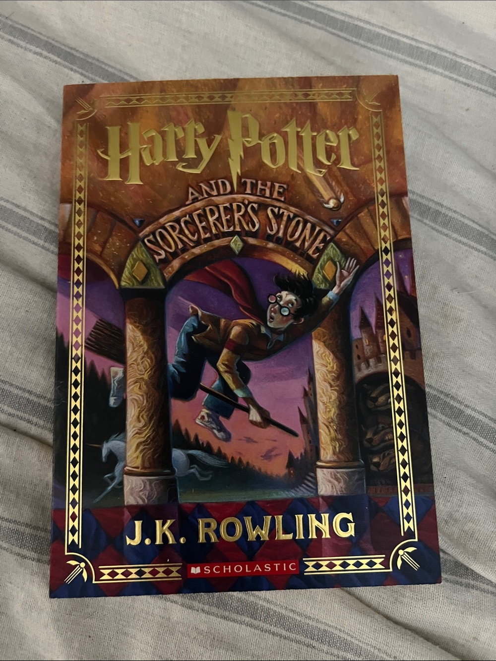 5/$10 itemScholastic Harry Potter and the Sorcerer's Stone — Gold & Purple Cover